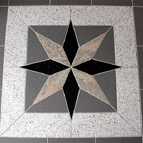 Verschiedene Materialien in Form eines Sterns bestehend aus Star Galaxy, Juparana, grauen Keramikfliesen und Bethel White.